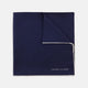 The Navy and White Piped Silk Pocket Square by Turnbull & Asser features white edging and partial corner folding, with the brand’s name printed in white near the lower edge.