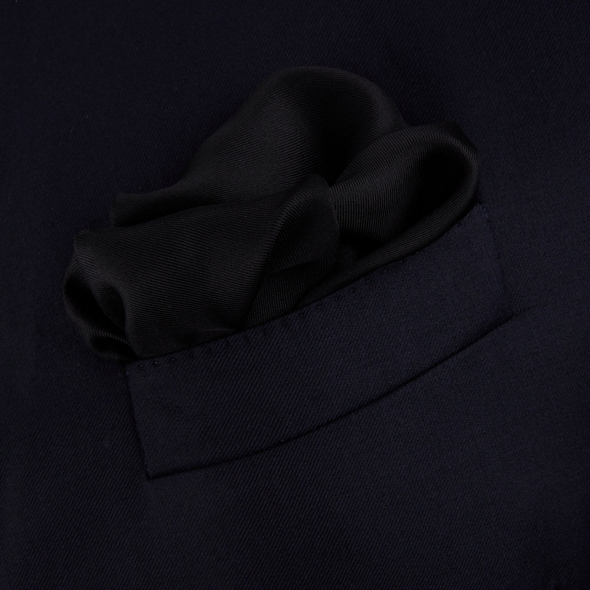 View 3 of product Add a touch of elegance with Turnbull & Asser’s Black and White Piped Silk Pocket Square, featuring white piping on one edge and the brand’s embroidered logo in white for a refined, classic look.
