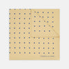 View 1 of product The Yellow and Blue Spot Silk Pocket Square by Turnbull & Asser features evenly spaced blue dots on yellow silk, with the brand name printed in one corner and a refined folded finish.