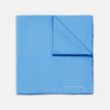 View 1 of product The Light Blue and Navy Piped Silk Pocket Square by Turnbull & Asser, neatly folded with dark blue edges and the brand’s white logo in the corner, is shown on a plain white background—a refined accessory for any occasion.
