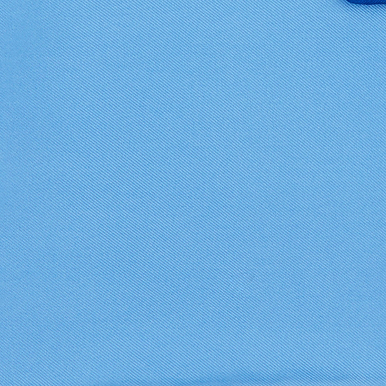 View 3 of product The Light Blue and Navy Piped Silk Pocket Square by Turnbull & Asser, neatly folded with dark blue edges and the brand’s white logo in the corner, is shown on a plain white background—a refined accessory for any occasion.