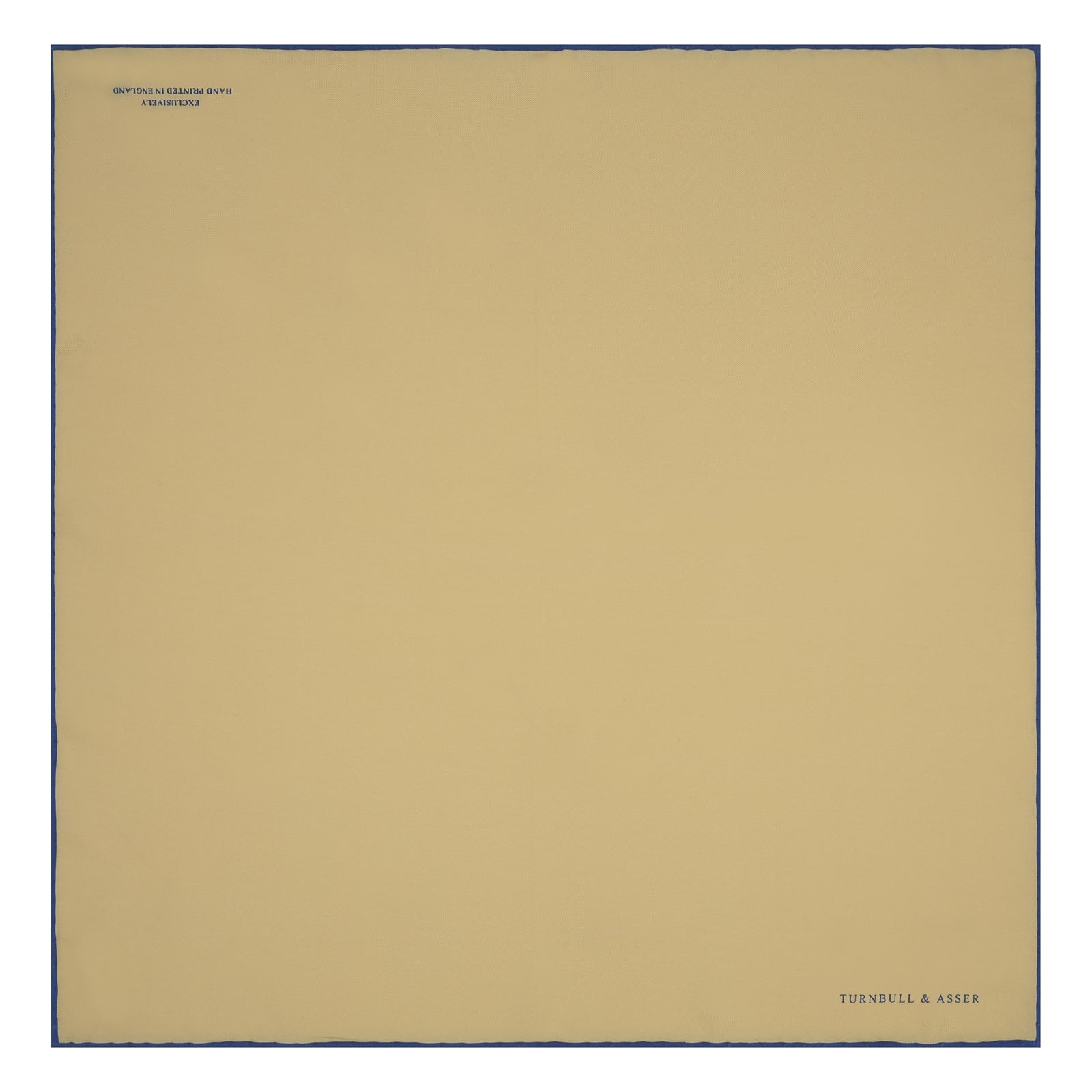 View 2 of product The Yellow and Navy Piped Silk Pocket Square by Turnbull & Asser features blue piping and the brand’s logo in blue on yellow silk—an elegant accessory for any outfit.