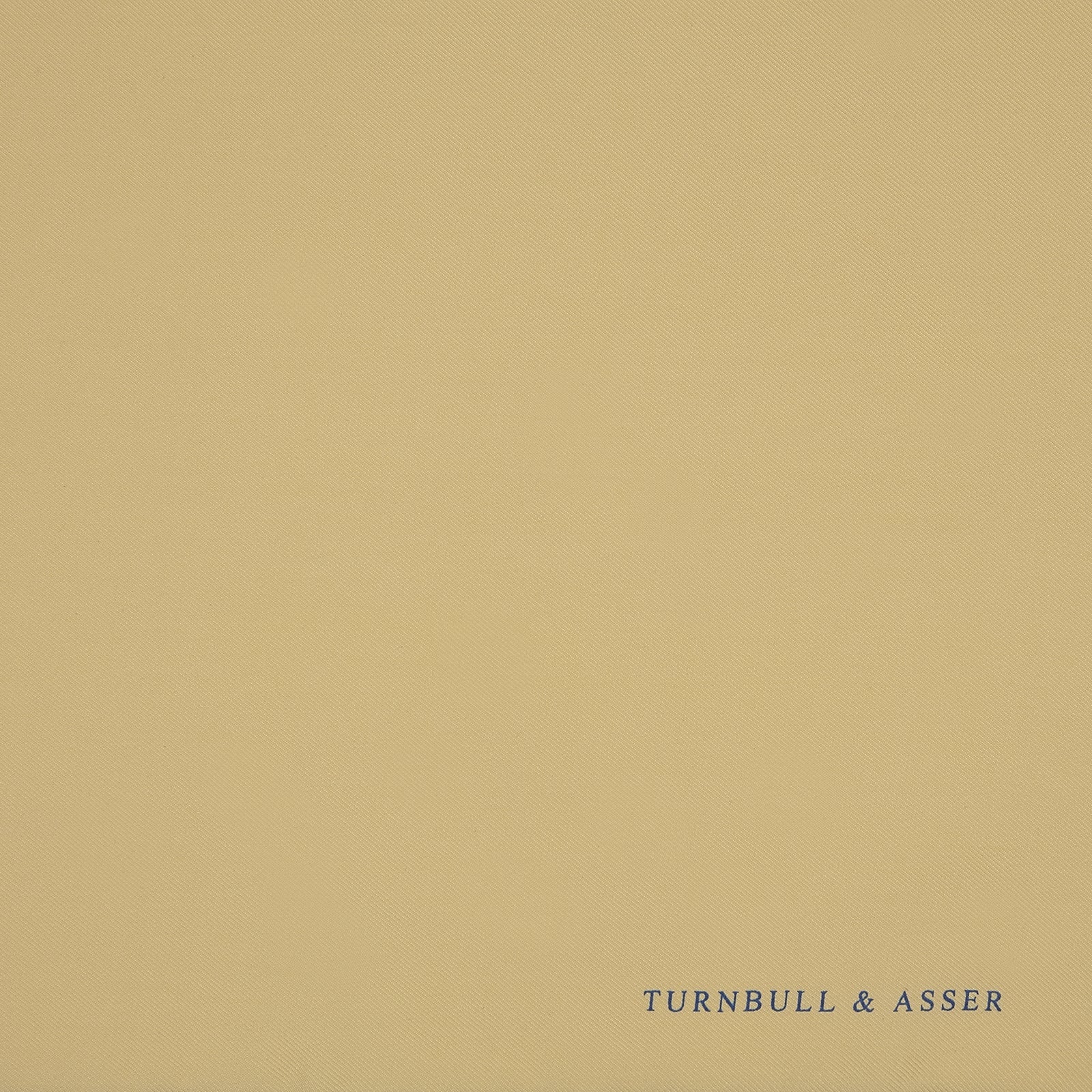 View 3 of product The Yellow and Navy Piped Silk Pocket Square by Turnbull & Asser features blue piping and the brand’s logo in blue on yellow silk—an elegant accessory for any outfit.