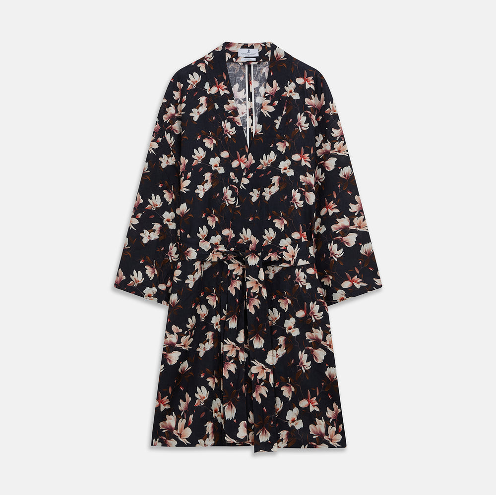 The Turnbull & Asser Navy Floral Pattern Linen Hayhurt Kimono Gown is a knee-length, long-sleeved gown with a floral print and a matching fabric belt tied at the waist.