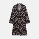 The Turnbull & Asser Navy Floral Pattern Linen Hayhurt Kimono Gown is a knee-length, long-sleeved gown with a floral print and a matching fabric belt tied at the waist.