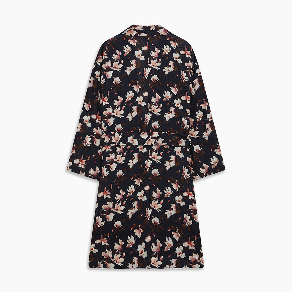 The Turnbull & Asser Navy Floral Pattern Linen Hayhurt Kimono Gown is a knee-length, long-sleeved gown with a floral print and a matching fabric belt tied at the waist.
