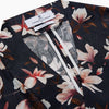 View 3 of product The Turnbull & Asser Navy Floral Pattern Linen Hayhurt Kimono Gown is a knee-length, long-sleeved gown with a floral print and a matching fabric belt tied at the waist.