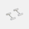 View 1 of product Turnbull & Asser’s Sterling Silver Bar Cufflinks feature a textured cylindrical design and chain links, making them an elegant men’s accessory, shown here on a plain white background.