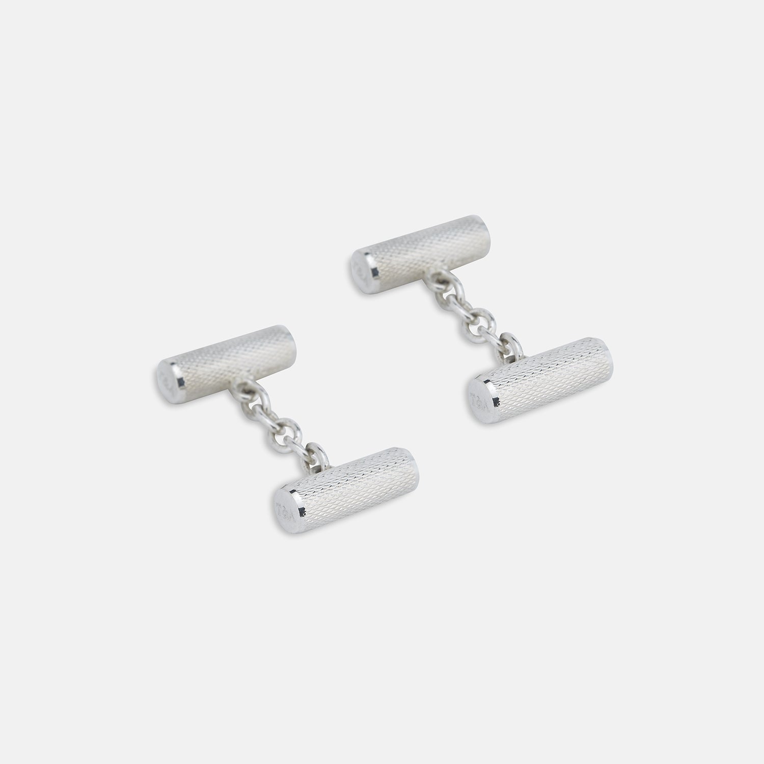 View 1 of product Turnbull & Asser’s Sterling Silver Bar Cufflinks feature a textured cylindrical design and chain links, making them an elegant men’s accessory, shown here on a plain white background.