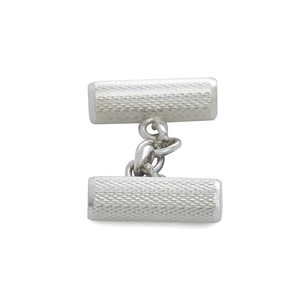 Turnbull & Asser’s Sterling Silver Bar Cufflinks feature a textured cylindrical design and chain links, making them an elegant men’s accessory, shown here on a plain white background.