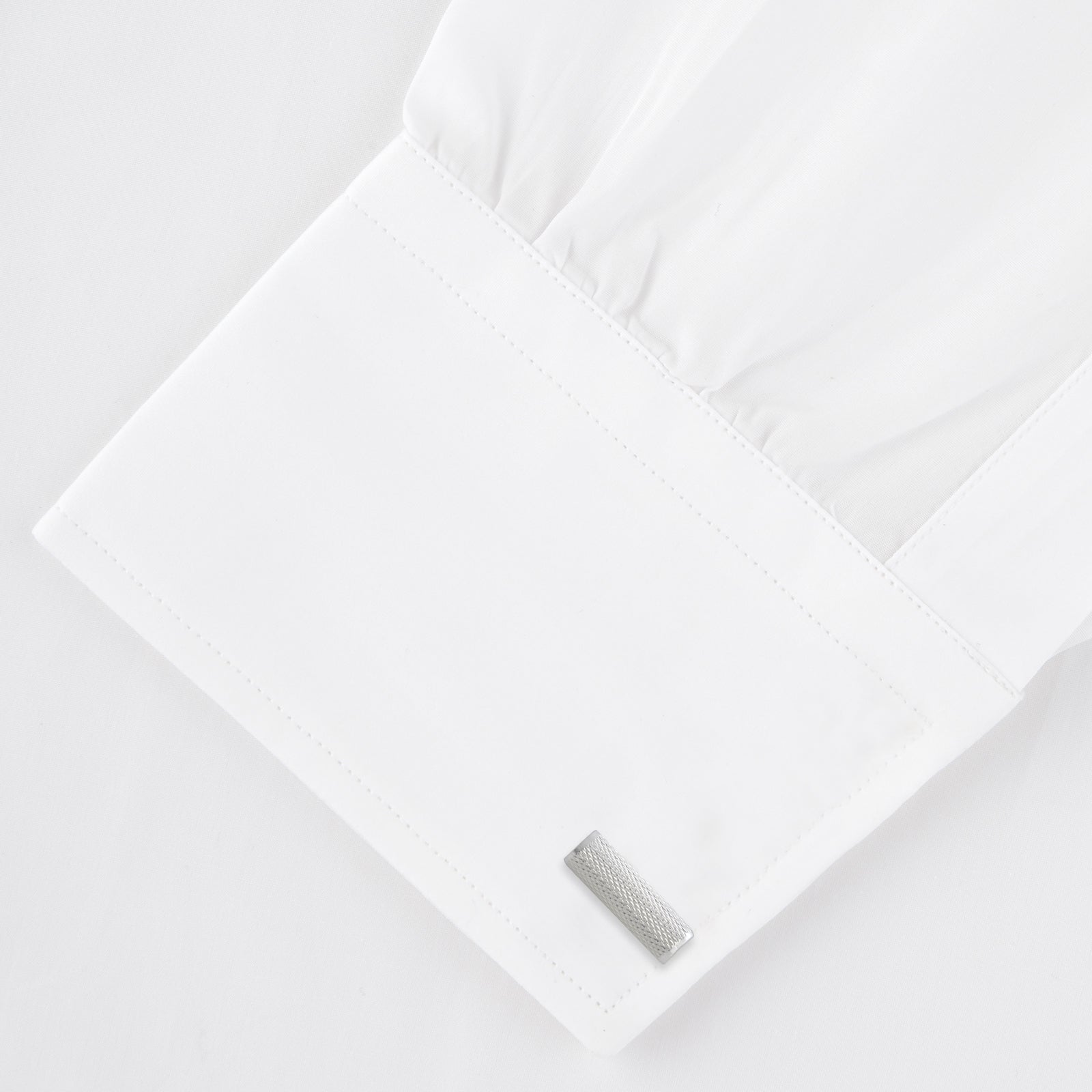 View 4 of product Turnbull & Asser’s Sterling Silver Bar Cufflinks feature a textured cylindrical design and chain links, making them an elegant men’s accessory, shown here on a plain white background.