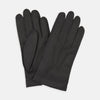 View 1 of product The Walden Black Leather Gloves by Turnbull & Asser, crafted from hairsheep leather with decorative stitching, are shown overlapping on a white background—an elegant showcase of timeless luxury and refined style.