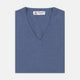 The Turnbull & Asser Blue V-Neck Cashmere Slipover, neatly folded with the label visible, is crafted from soft cashmere and ideal for formal layering. Shown against a white background.