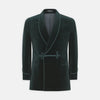 View 1 of product The Turnbull & Asser Green Double Breasted Velvet Smoking Jacket features a shawl collar, frog closures, and trim detailing on the cuffs and edges, shown against a white background—a sophisticated piece of eveningwear.
