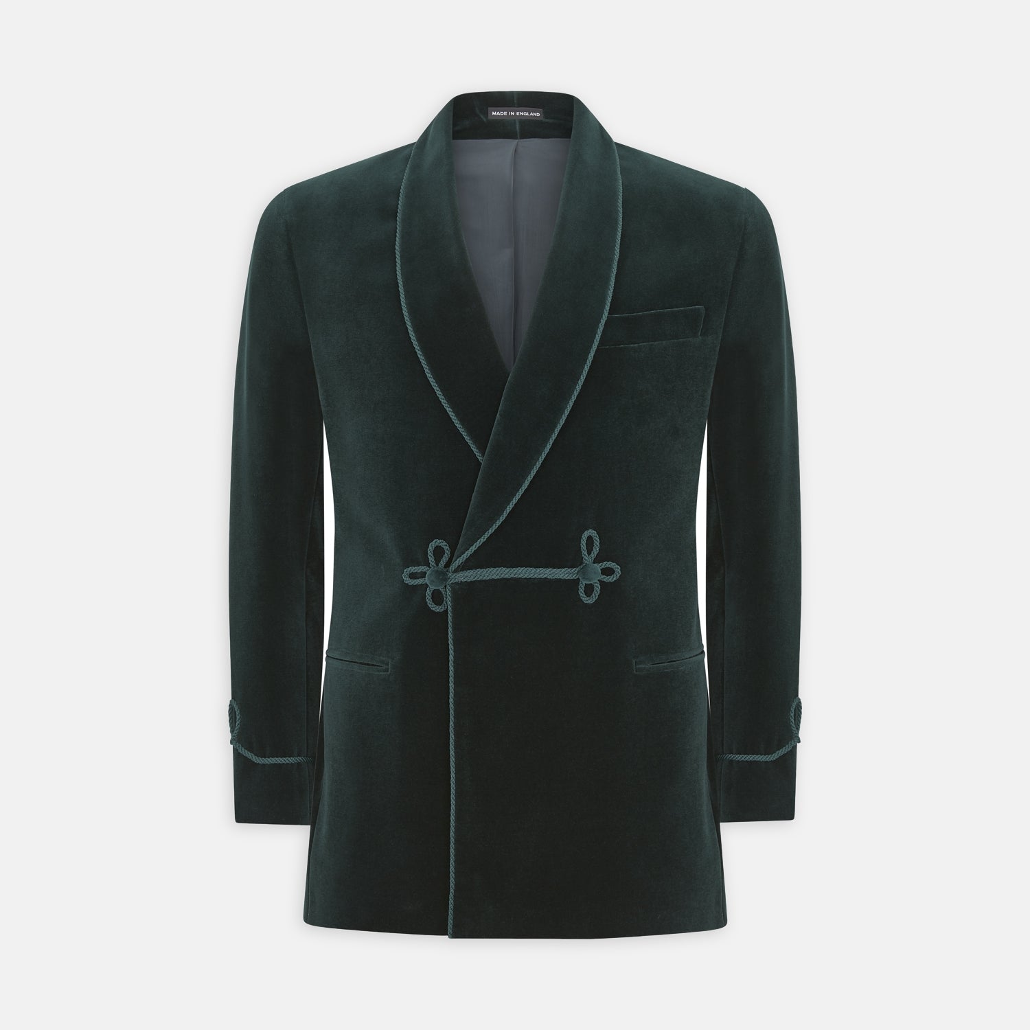 View 1 of product The Turnbull & Asser Green Double Breasted Velvet Smoking Jacket features a shawl collar, frog closures, and trim detailing on the cuffs and edges, shown against a white background—a sophisticated piece of eveningwear.