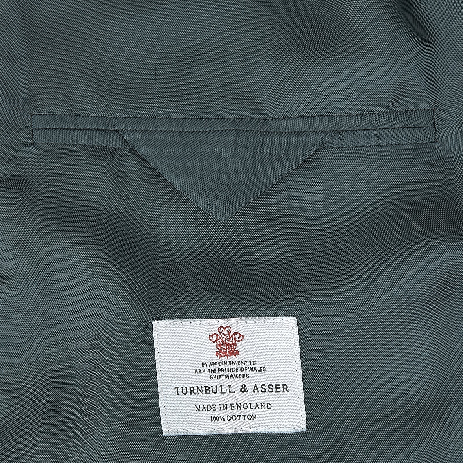 View 2 of product The Turnbull & Asser Green Double Breasted Velvet Smoking Jacket features a shawl collar, frog closures, and trim detailing on the cuffs and edges, shown against a white background—a sophisticated piece of eveningwear.