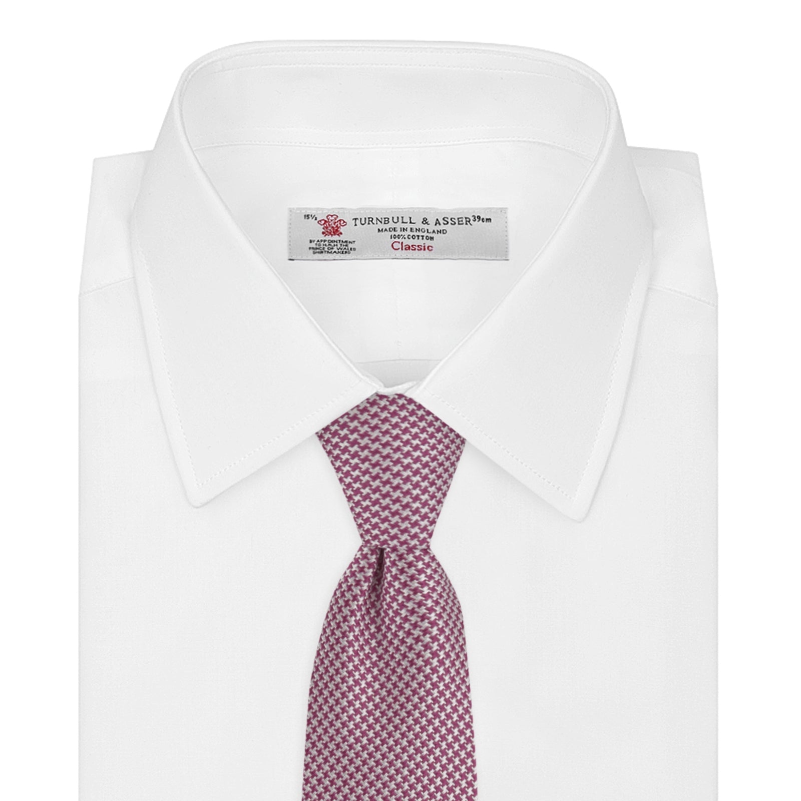 View 2 of product The Turnbull & Asser Dark Pink Houndstooth Silk Tie is rolled up and displayed on a plain white background.