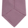 View 4 of product The Turnbull & Asser Dark Pink Houndstooth Silk Tie is rolled up and displayed on a plain white background.
