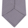 View 4 of product The Plum Houndstooth Silk Tie by Turnbull & Asser features a refined small black, white, and gray pattern—perfect as an office shirt accessory—shown rolled up on a plain white background.