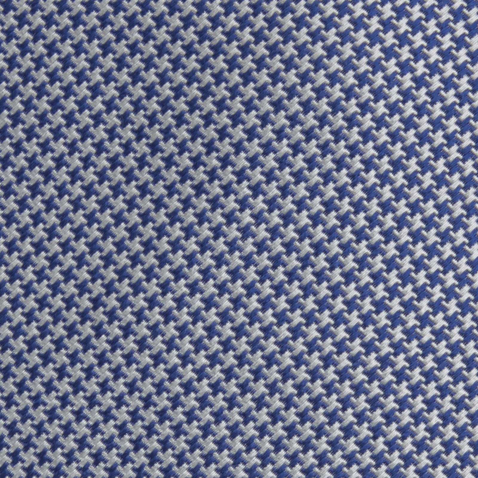 View 3 of product The Turnbull & Asser Blue Houndstooth Silk Tie features a classic blue and white pattern, rolled and displayed on a white background—an elegant accessory for your favorite office shirt.