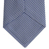 View 4 of product The Turnbull & Asser Blue Houndstooth Silk Tie features a classic blue and white pattern, rolled and displayed on a white background—an elegant accessory for your favorite office shirt.