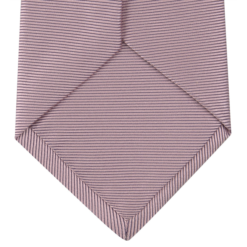 The Turnbull & Asser Rose Horizontal Twill Silk Tie features a pale pink ribbed silk texture, displayed on a white background—ideal for adding a smart touch to cotton shirts.