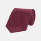A Turnbull & Asser Dark Pink Plain Satin Silk Tie, crafted from satin silk, is rolled up and displayed on a plain white background.