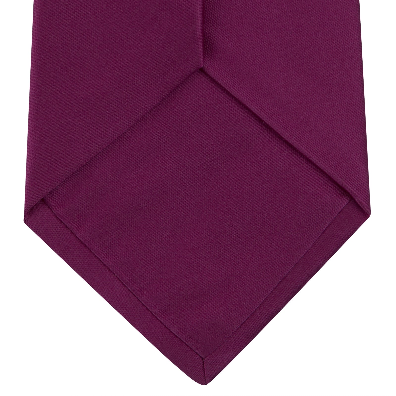 View 4 of product A Turnbull & Asser Dark Pink Plain Satin Silk Tie, crafted from satin silk, is rolled up and displayed on a plain white background.