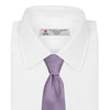 View 2 of product The Turnbull & Asser Lilac Plain Satin Silk Tie, featuring a smooth finish, is neatly rolled and displayed on a white background—a classic accessory for any versatile wardrobe.