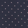 View 3 of product The Turnbull & Asser Navy and Rose Spot Lace Silk Tie features a rolled-up navy design with delicate rose spots, ideal for adding elegance to any office shirt, shown against a plain white background.