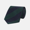 View 1 of product The Turnbull & Asser Navy and Forest Green Block Stripe Repp Silk Tie features bold stripes and is expertly crafted from luxurious silk, shown rolled on a white background.