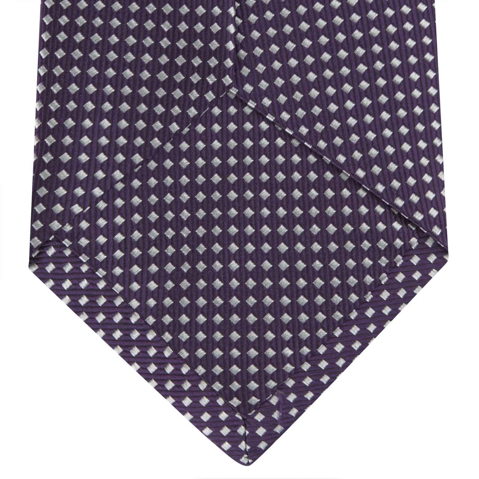 View 4 of product The Turnbull & Asser Plum and White Diamond Silk Tie features a subtle repeating pattern, shown rolled up on a white background—a timeless accessory to elevate any office shirt.
