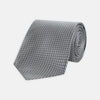 View 1 of product The Turnbull & Asser Grey and White Diamond Silk Tie, featuring a subtle textured pattern, is perfect for pairing with an office shirt and is displayed against a white background.