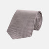 View 1 of product The Turnbull & Asser Rose and White Diamond Silk Tie, shown rolled on a white background, features a subtle diamond pattern—an elegant accessory to elevate any office shirt.