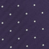 View 3 of product The Turnbull & Asser Plum and White Small Spot Herringbone Silk Tie is shown rolled up on a plain white background, featuring a classic silk herringbone weave in plum with small white spots.