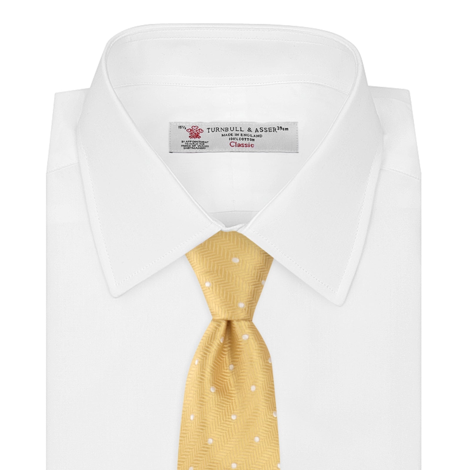 View 2 of product The Turnbull & Asser Gold and White Small Spot Herringbone Silk Tie is crafted from fine English silk, featuring a gold herringbone weave with white polka dots, and is shown rolled up on a white background.