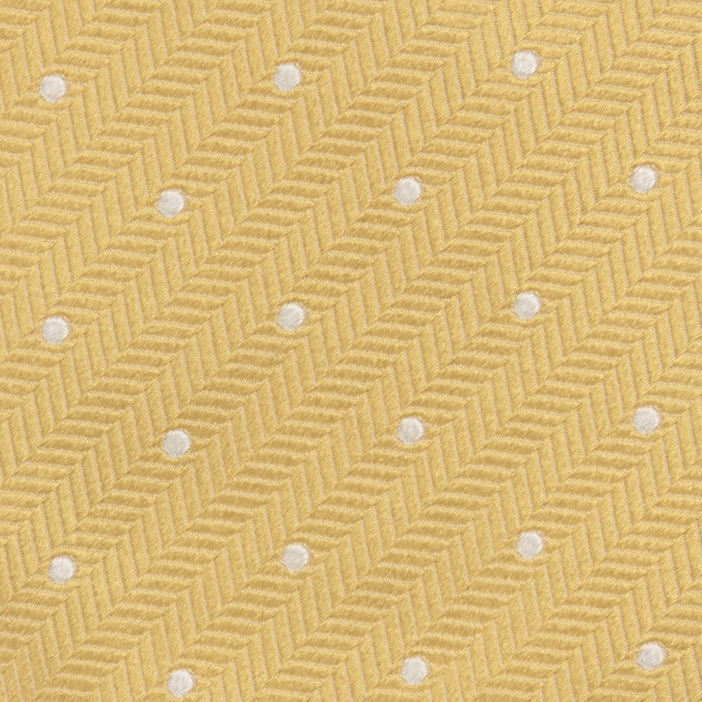 The Turnbull & Asser Gold and White Small Spot Herringbone Silk Tie is crafted from fine English silk, featuring a gold herringbone weave with white polka dots, and is shown rolled up on a white background.
