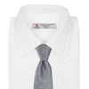 View 2 of product The Turnbull & Asser Grey and White Small Spot Herringbone Silk Tie, expertly woven from silk, is displayed rolled-up against a white background.