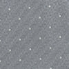 View 3 of product The Turnbull & Asser Grey and White Small Spot Herringbone Silk Tie, expertly woven from silk, is displayed rolled-up against a white background.
