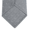 View 4 of product The Turnbull & Asser Grey and White Small Spot Herringbone Silk Tie, expertly woven from silk, is displayed rolled-up against a white background.