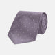 The Turnbull & Asser Lilac and White Small Spot Herringbone Silk Tie, crafted from fine English silk, is neatly rolled and displayed on a plain white background.