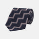 The Turnbull & Asser Navy and Rose Striped Zigzag Silk Tie features a bold zigzag pattern and is shown against a plain white background, making it an ideal accessory for the modern gentleman.