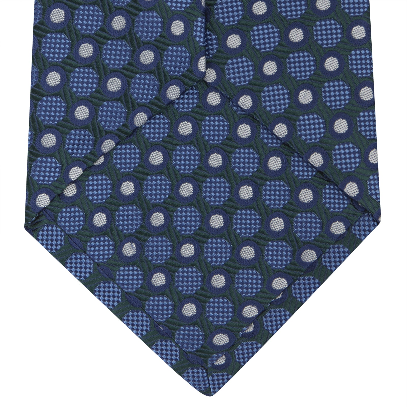 View 4 of product Turnbull & Asser’s Forest Green and Blue Circle and Spot Silk Tie, rolled on a white background, features a refined pattern—an elegant classic for any office shirt.