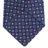 View 4 of product The Turnbull & Asser Plum and Blue Circle and Spot Silk Tie, shown rolled up on a white background, features a classic pattern—an elegant choice to complement any office shirt.