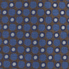 View 3 of product The Turnbull & Asser Brown and Blue Circle and Spot Silk Tie features a repeating pattern of brown and blue spots, ideal for office wear, shown on a white background.