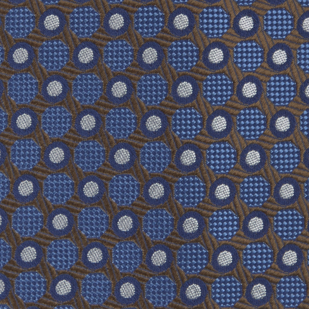 The Turnbull & Asser Brown and Blue Circle and Spot Silk Tie features a repeating pattern of brown and blue spots, ideal for office wear, shown on a white background.
