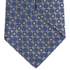 View 4 of product The Turnbull & Asser Silver and Blue Circle and Spot Silk Tie features a classic geometric pattern in silver and light blue on white, making it the perfect complement to any office shirt.