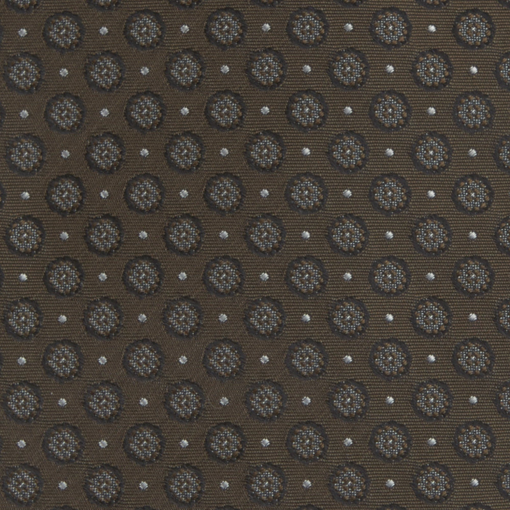 The Brown Floral Spot Silk Tie by Turnbull & Asser features a classic brown base with silver-gray floral spots—an elegant accessory that pairs perfectly with your office shirts.