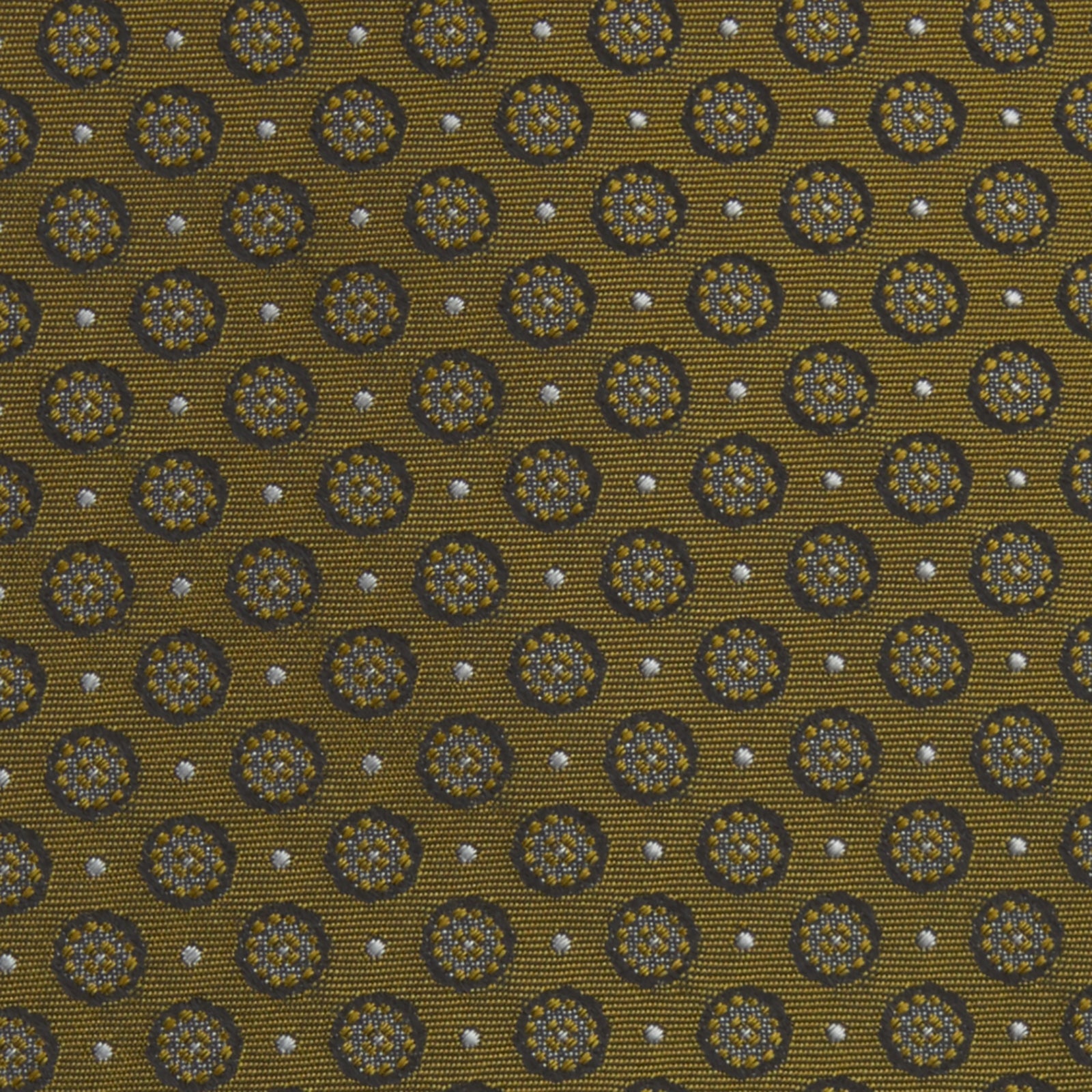 View 3 of product The Gold Floral Spot Silk Tie by Turnbull & Asser showcases a rolled-up design in olive green silk with light floral spots, perfect for adding a refined touch to any office shirt and standing out against a plain white background.