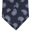 View 4 of product The Turnbull & Asser Navy and Light Blue Floating Paisley Silk Tie features a repeating light blue and white paisley pattern set against a navy blue silk backdrop.